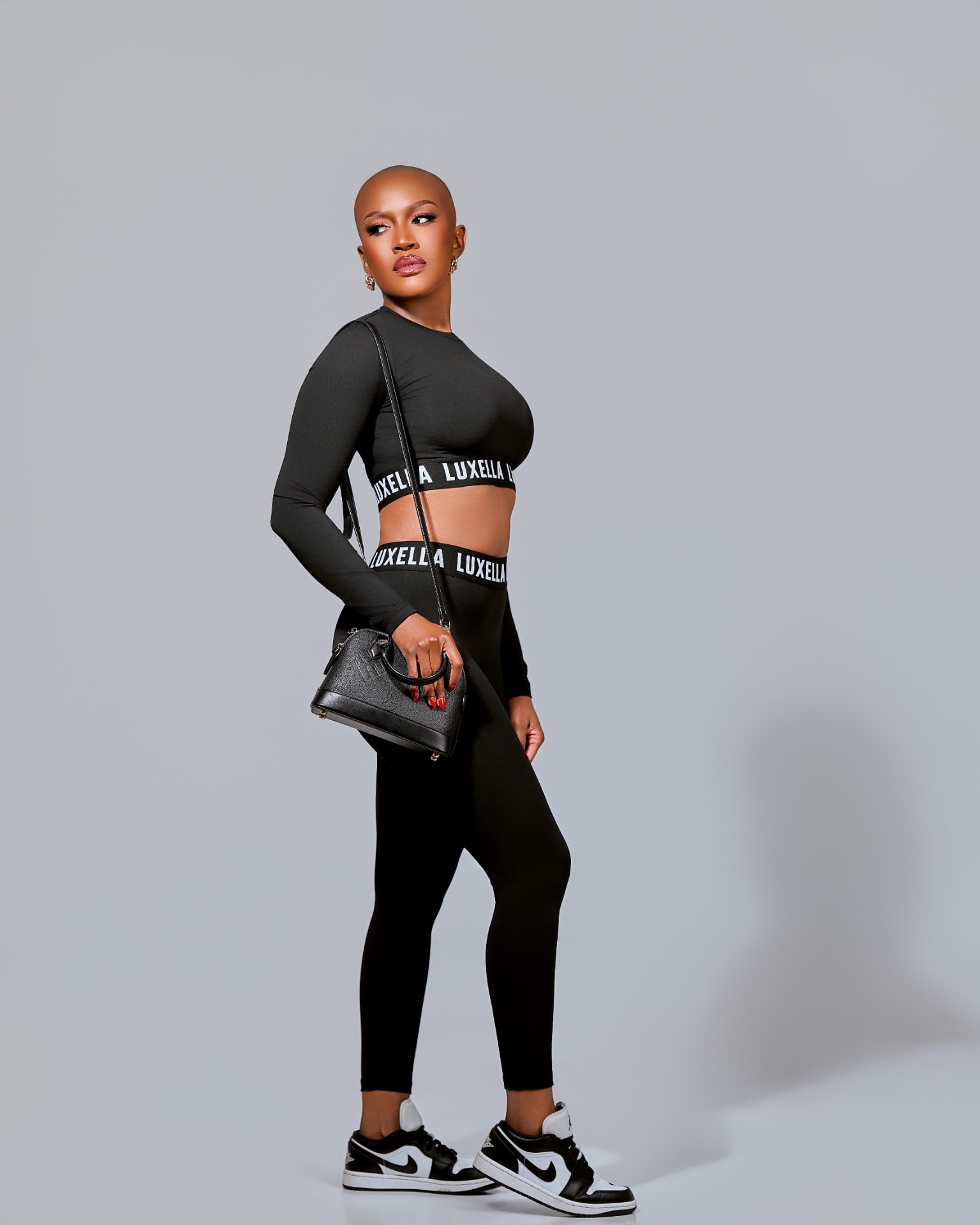 Luxella AW26 campaign — black performance set with the Noir Dome Mini